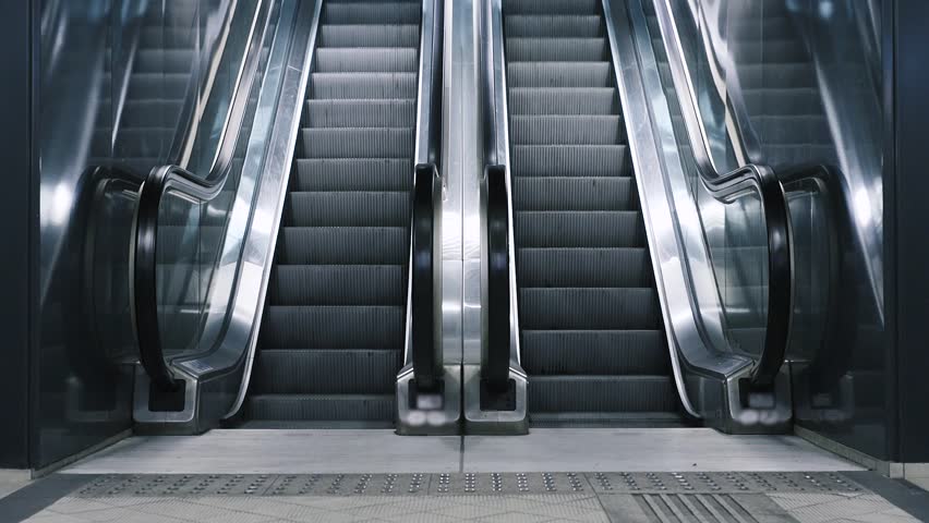 Close-up shot of empty moving staircase running up and down. Modern escalator stairs, which moves indoor. Royalty-Free Stock Footage #20849128