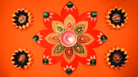 Decorative drawings called Rangoli designs around Diwali lamp during Diwali festival, Mumbai, Maharashtra, India, Southeast Asia.: film stockowy