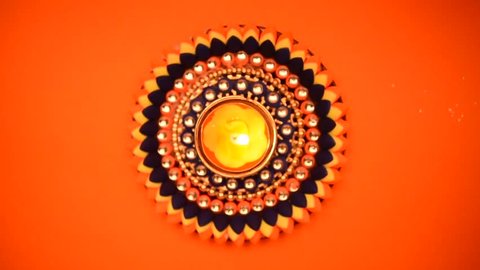 Decorative drawings called Rangoli designs around Diwali lamp during Diwali festival, Mumbai, Maharashtra, India, Southeast Asia. Stock Video