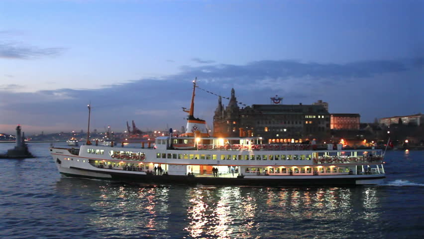 Beautiful passenger ship sails in to night at Kadikoy, Istanbul
