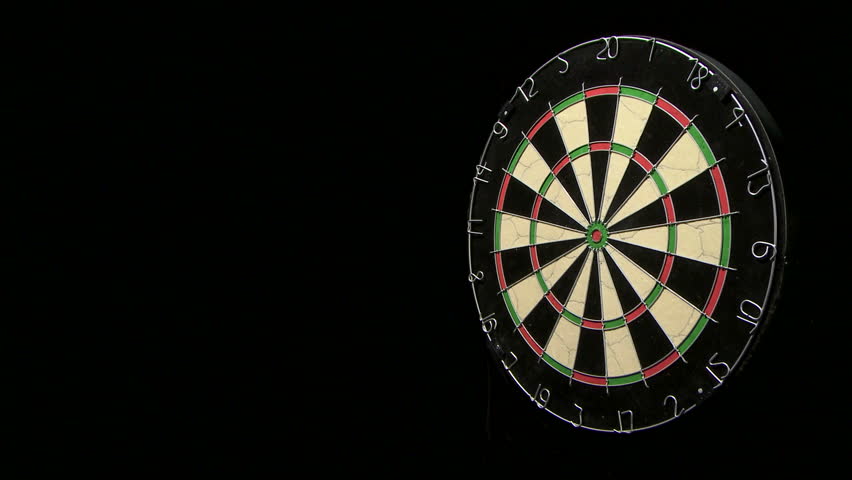 Wide shot of three darts along with a bull's eye on a dart board