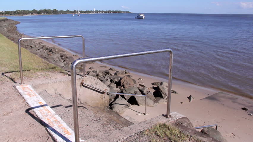 Concrete steps leading down to the beach and water.