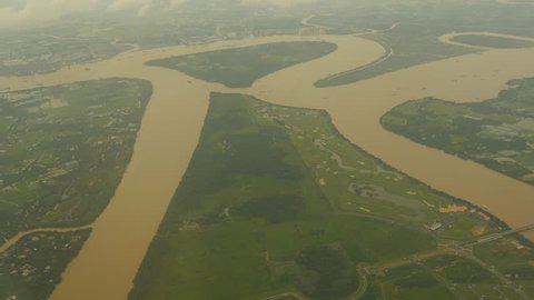 View from the window of an airplane on the Mekong River. Vietnam.