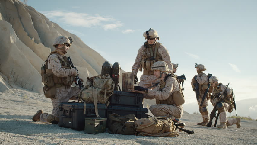 Soldiers are Using Laptop Computer for Surveillance During Military Operation in the Desert. Slow Motion. Shot on RED EPIC Cinema Camera in 4K (UHD).