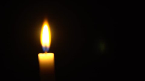 Candle in black background