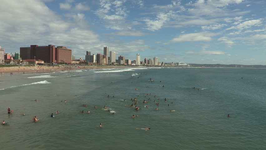 Bathers catching waves at Durban's Ushaka Beach
