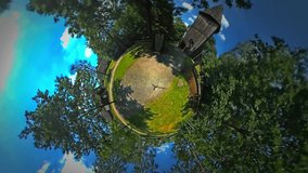 Tiny Little Planet 360 Degree Timelapse. Wooden Bell-Tower, Rural Landscape. Old Village in Sunny Summer Day, Opole Country. Blue Sky. Fresh Green Trees, Green Lawns Outdoors. Mini Planet,