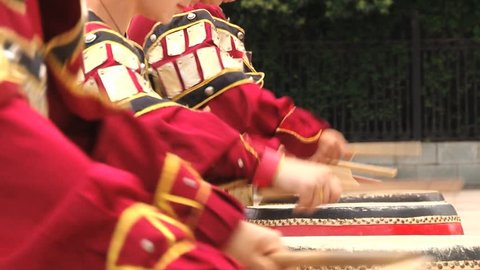 XIAN, CHINA - MAY 29, 2013: Unidentified people play traditional drum instruments in the Datang Furong Garden in Xian, China.