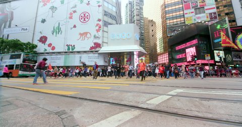 CHINA, HONG KONG - FEBRUARY 2016: Pedestrians Cross Yee Wo Street & Hennessy Road; Causeway Bay Hong Kong China