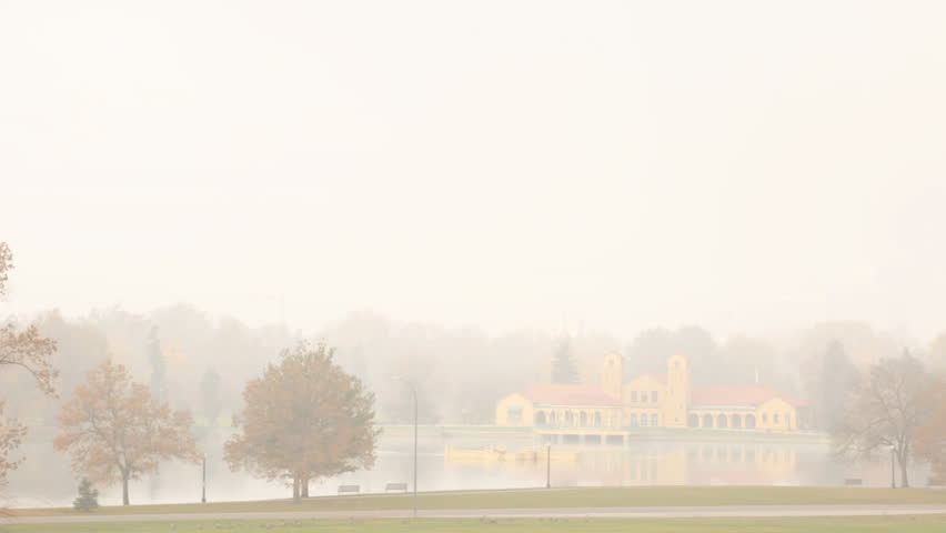 Sunrise in thick fog in Denver City Park.
