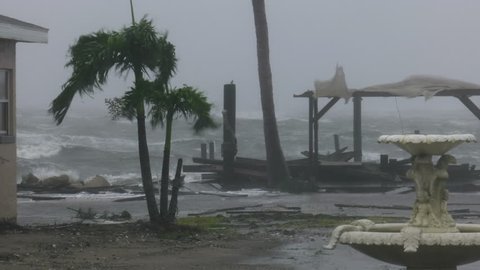 Cocoa Beach, FL/US - October 8, 2016 [4K Hurricane Matthew producing hurricane force wind gusts a pounding local beach motel along with damaging storm surge.]