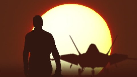 F22 fighter pilot walks against sunrise