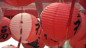 Many Chinese Red Lanterns Moving With Wind Outdoors