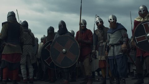 Army of Vikings are Raising Swords and Crying Before Battle. Shot on RED Cinema Camera in 4K (UHD).