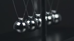 Slow motion shot of a Newton's Cradle. - Powered by Shutterstock - Get 15% off with code: PIKWIZARD15