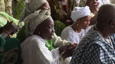 Osogbo, Nigeria - August 2013;Women singing at ceremony at Ataoja palace.