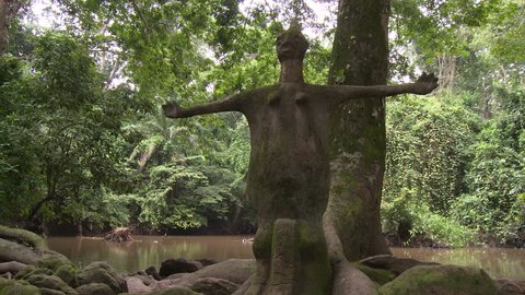 Osogbo, Nigeria - August 2013;Statue of fertility goddess on the banks of the Osun River.