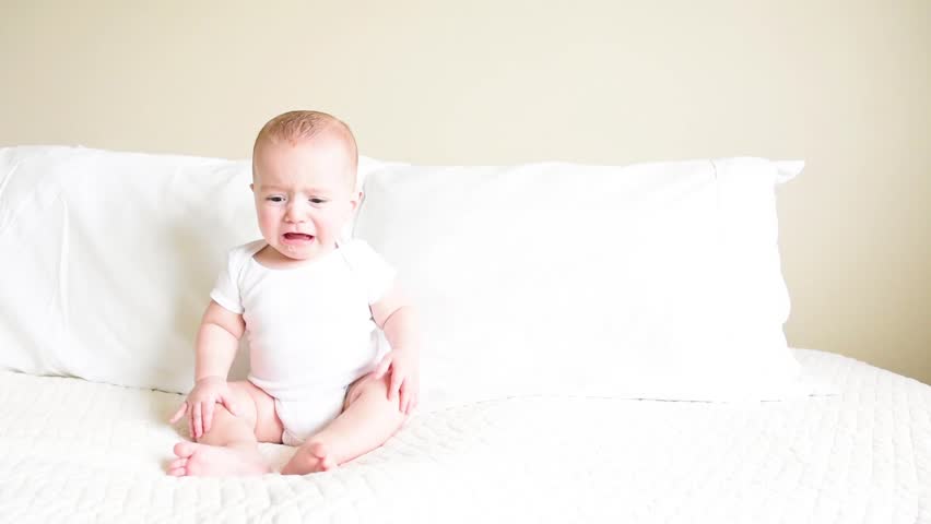 baby in white onesie