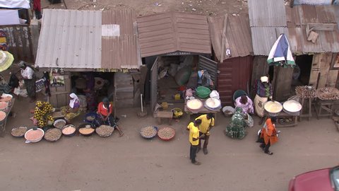 Osogbo, Nigeria - August 2013; High angle view of market stalls and passing traffic