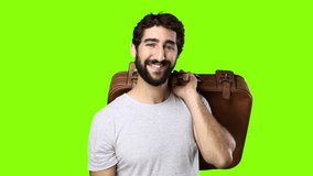 young crazy man with suitcase on chroma key 