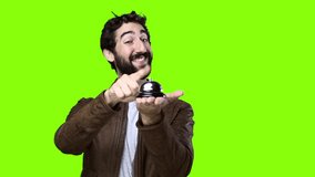 young crazy man with ring bell on chroma key 