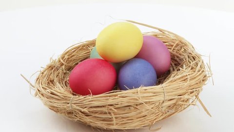 Coloured eggs in Easter nest Stock Video