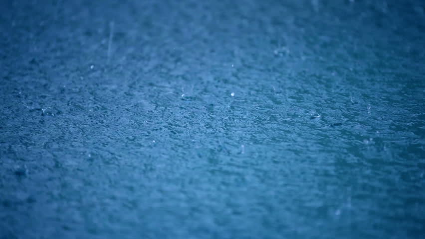 Rain drops splashing blue water surface of puddle on the wet floor, abstract nature background of a rainy weather day with heavy rainfall, close up seamless loop able video Royalty-Free Stock Footage #20932813