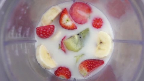 fruit mixing into blender seen from inside slow motion