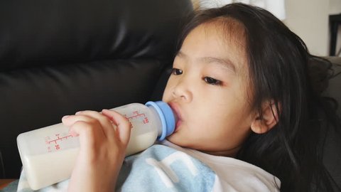 Toddler Drinking Milk Bottle