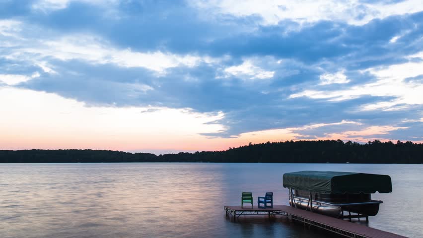 Time lapse video of the sun setting over a lake in northern Wisconsin. 4k time lapse, 4096x2304.