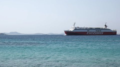 MYKONOS, GREECE- SEPTEMBER, 15, 2016: tracking shot as a ship from the fast ferries line arrives at mykonos, greece