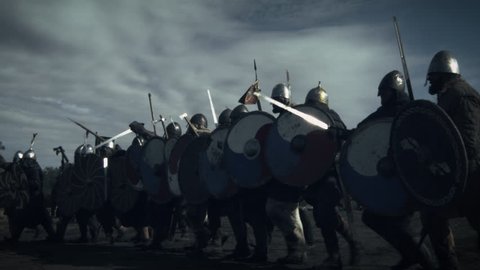 Advancing Army of Viking Warriors. Medieval Reenactment. Shot on RED Cinema Camera in 4K (UHD).