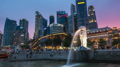 Singapore - June 29, 2016: 4K Singapore day to night time lapse. Singapore financial district and Marina bay view