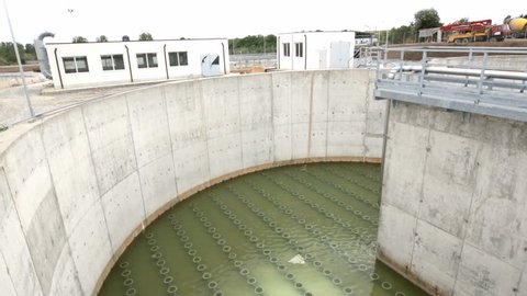 Modern urban wastewater treatment plant. Water cleaning facility outdoors. Water purification is the process of removing undesirable chemicals, suspended solids and gases from contaminated water.