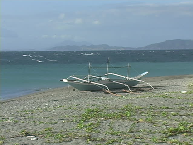 A beautiful handmade boat on a beach in the Philippines