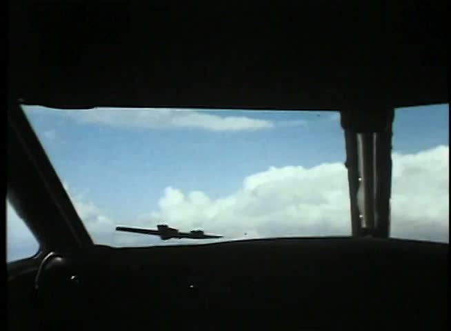 View from cockpit of military airplane in flight