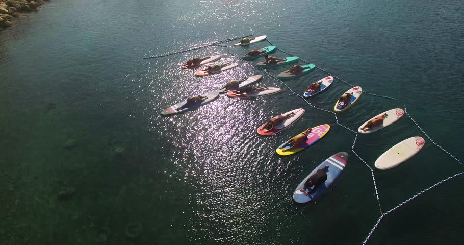 Pilates on a sup board at sea.