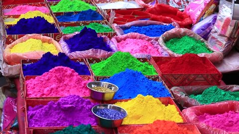 Colored colorful powder kumkum on local bazaar for holi festival celebration. Closeup. Kathmandu, Nepal Stockvideó