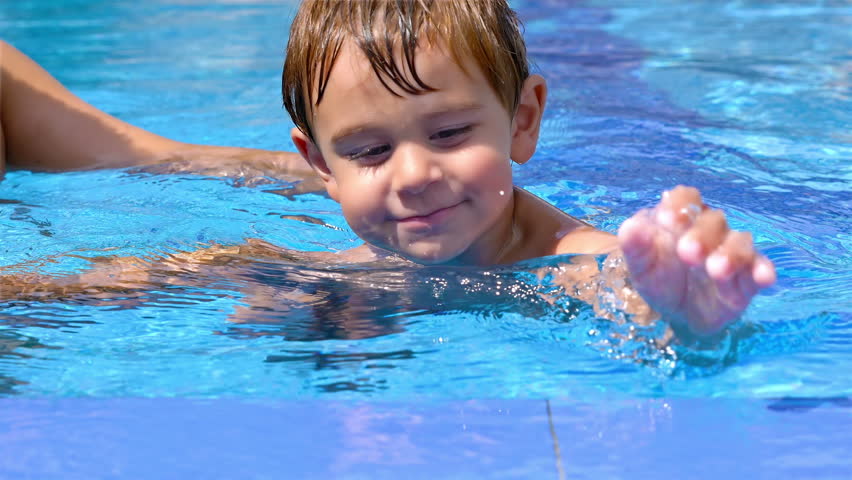 little boy swimming