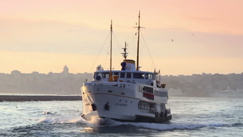 Passenger ship sails by the sunset in Istanbul

