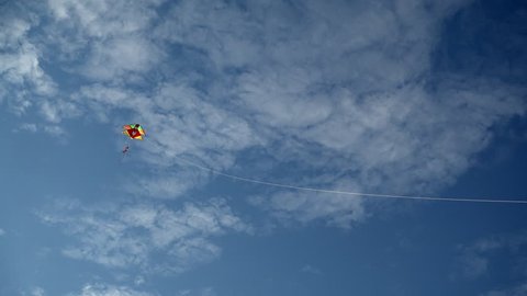 Lightweight toy kite flying in sky