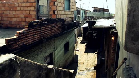 A Narrow Passage Among Poor Houses in a Shanty Town located along the Banks of the Paraguay River in Asuncion, Paraguay. Zoom In.