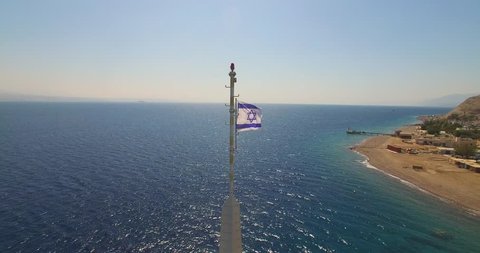  from Israeli flag to long shot of the Underwater Observatory in Eilat 