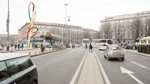 MILAN - FEBRUARY 20: Time lapse view of traffic on the main street on February 20, 2012 in Milan, Italy.