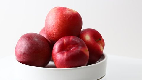 Rotating plums in a container