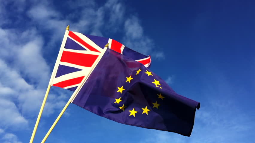 European Union and British Union Jack flag flying in front of bright blue sky in representation of the Brexit EU referendum Royalty-Free Stock Footage #21003838