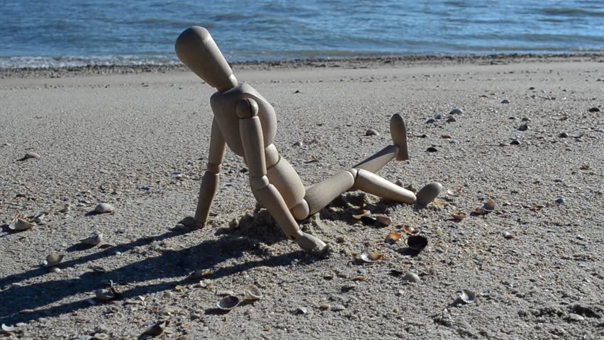 Wooden dummy on the beach.