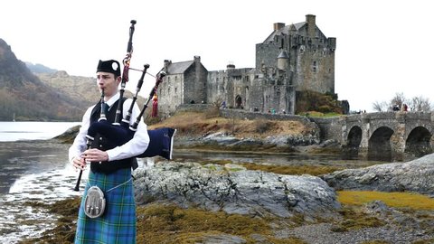 Scotland, MAR 27: 4K Video of Scotland style boy and Eilean Donan Castle on MAR 27, 2016 at United Kingdom.