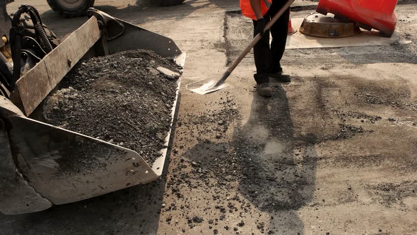 Workers with Shovels Throwing Asphalt. Stock Footage Video (100% ...