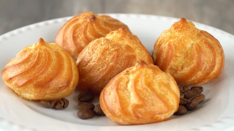 Delicious homemade pastry with coffee beans on a white plate. Seamless loopable. Prores 4K.